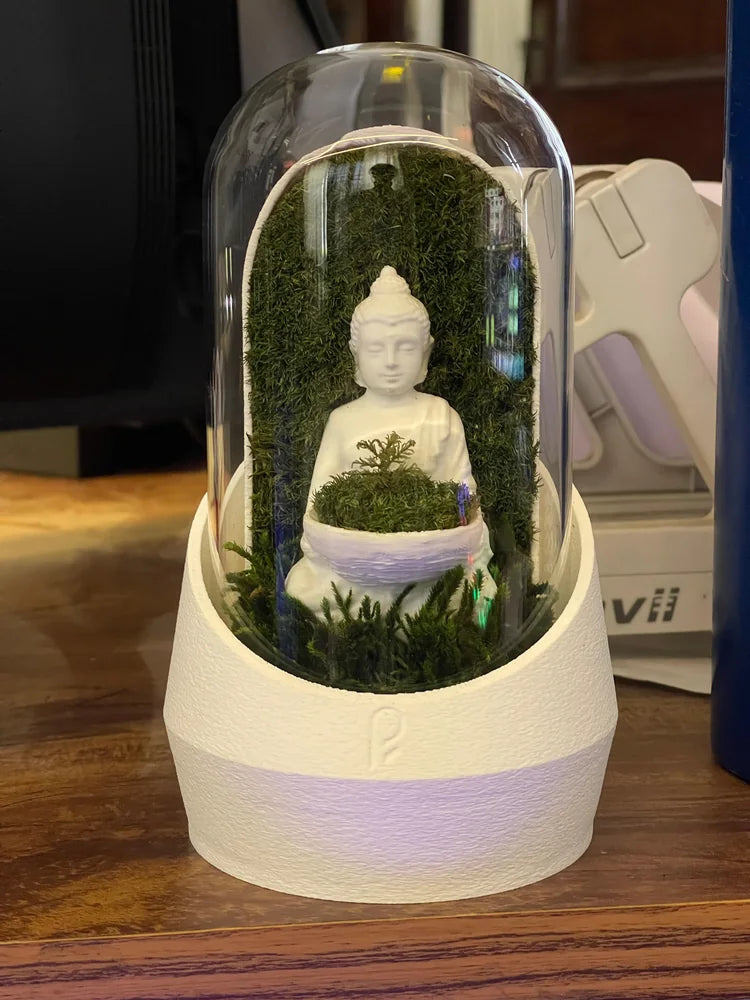 White Buddha dome beside a customer’s monitor
