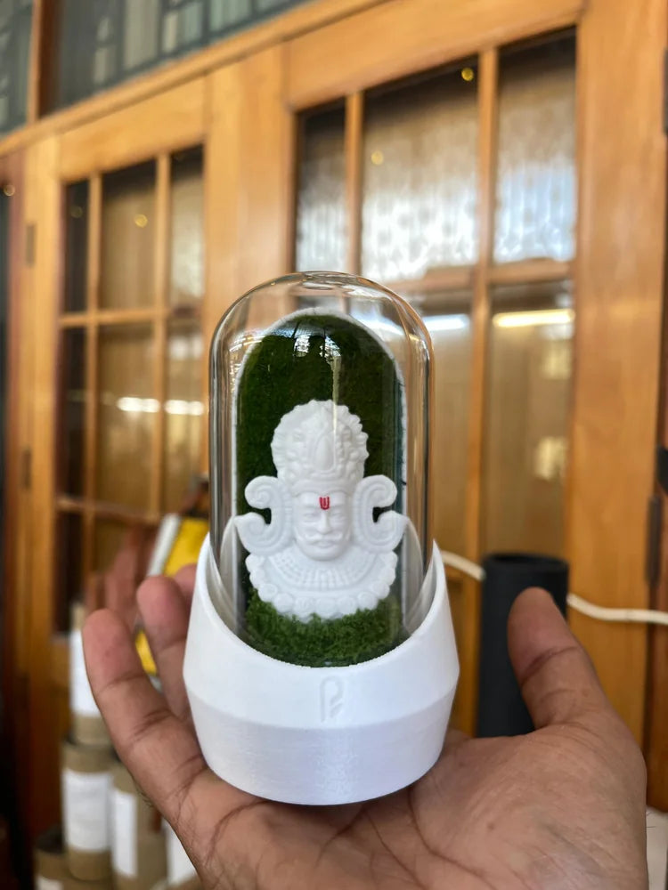 White Ganesha dome held in a customer’s hand